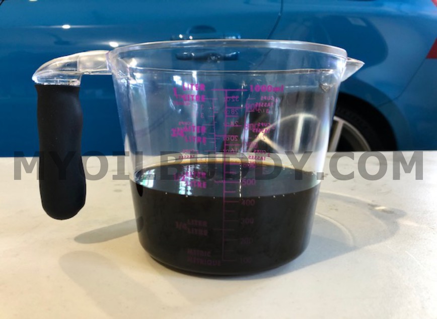 Old-volvo-gear-oil-in-measuring-cup